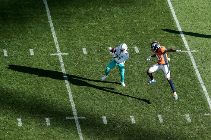 Xavien Howard steps in front of Broncos receiver Tim Patrick to intercept a pass during a 2020 game